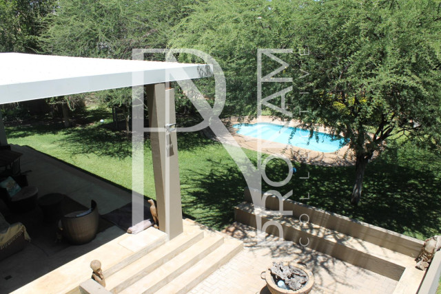 The view to the pool and the green garden