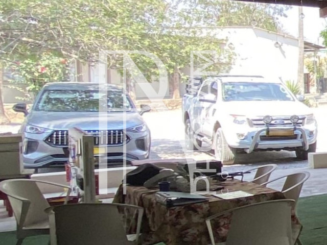 customers passing by a enjoying a cool drink in an outdor dinning area